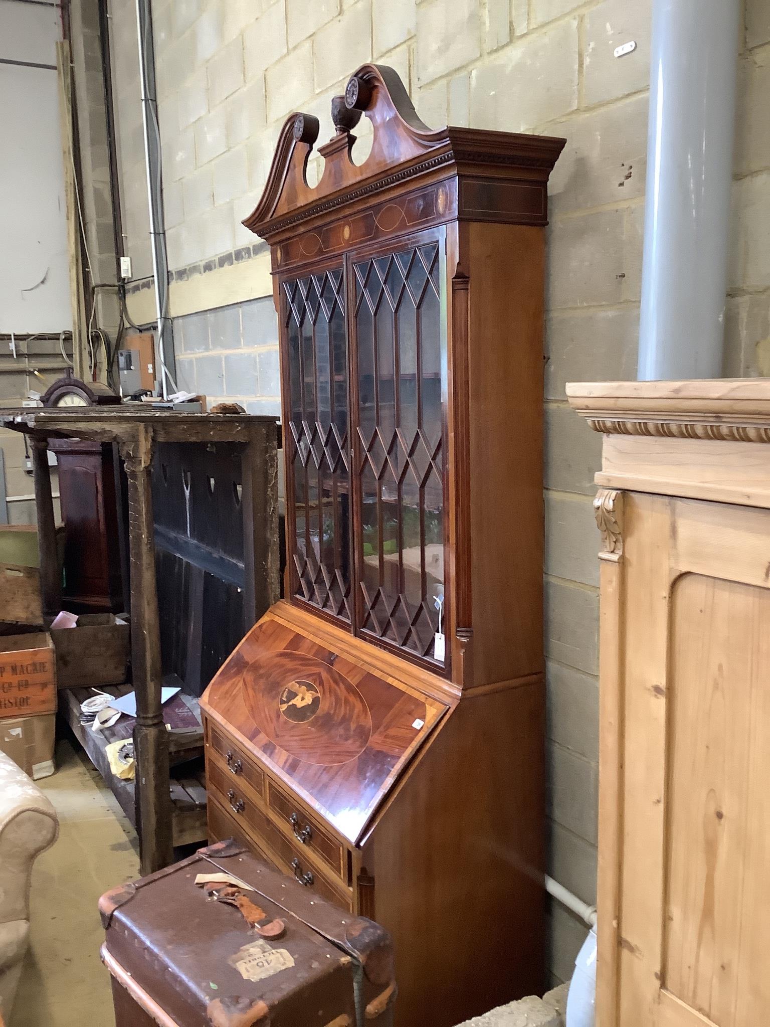 A good quality George III style inlaid and cross banded flamed mahogany bureau bookcase, width 132cm, depth 58cm, height 278cm